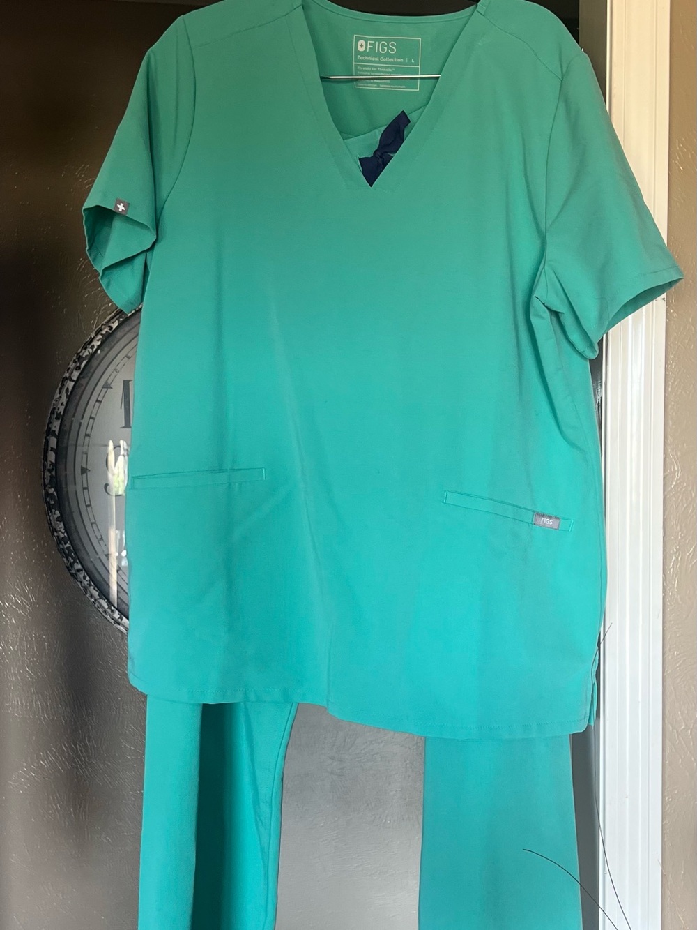 FIGS Women's surgical green V-Neck Scrub Top and Livingston pants .